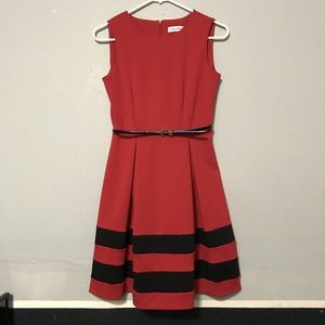 Red sleeveless dress with black belt